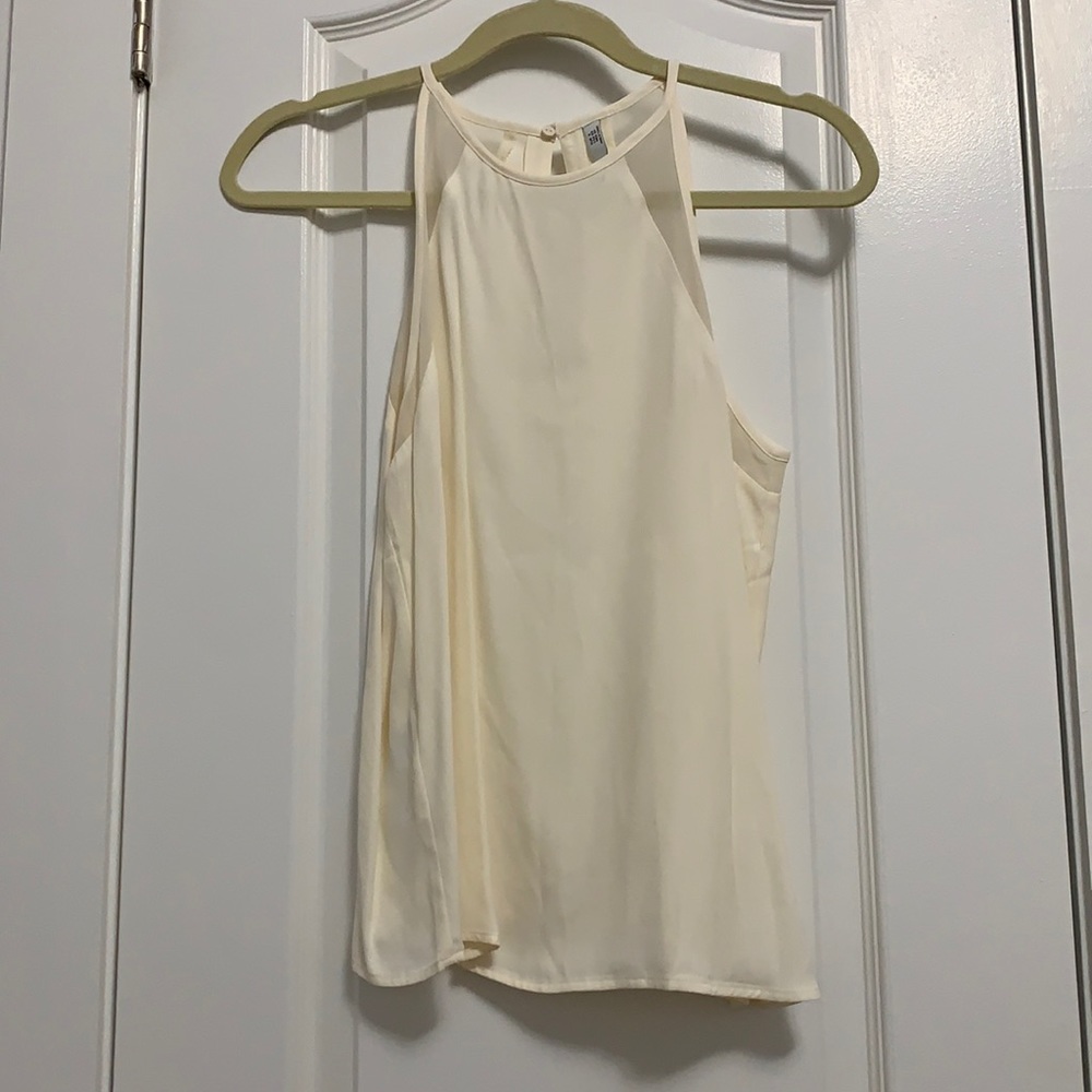 Cream sleeveless blouse